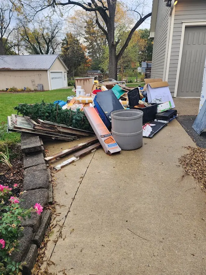 Dumpster being loaded with debris for Demolition Dumpster Rental in Pittsburg